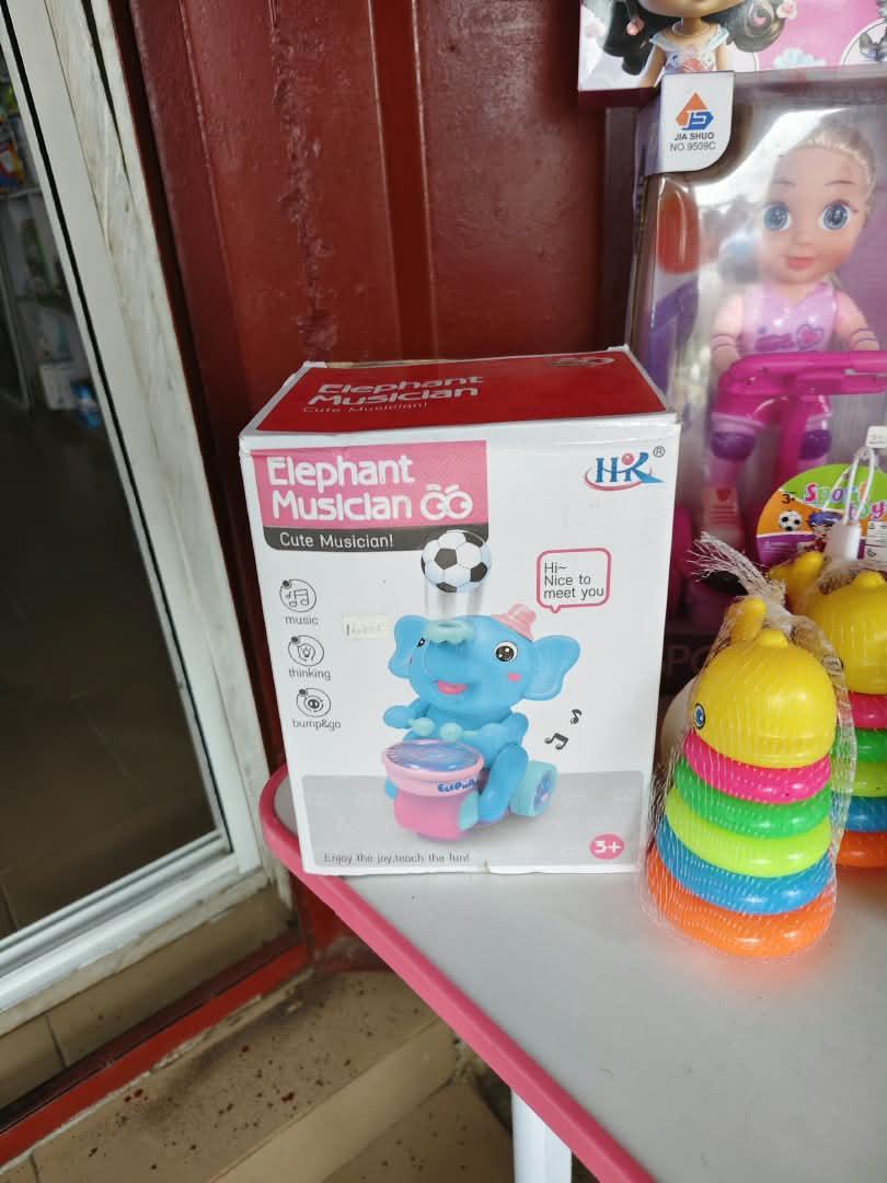 2-in-1-musical-learning-activity-table-s-nbk-stm-039 Bump & Go Elephant Musician Toy with Light, Drumming Melodies & Floating Ball - Image 1
