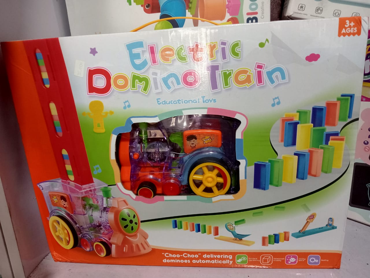 multi-level-city-parking-garage-die-cast-nbk-toy-050 Electric Transparent Gear Domino Train Toy with Sound & Auto-Laying Action - Image 1